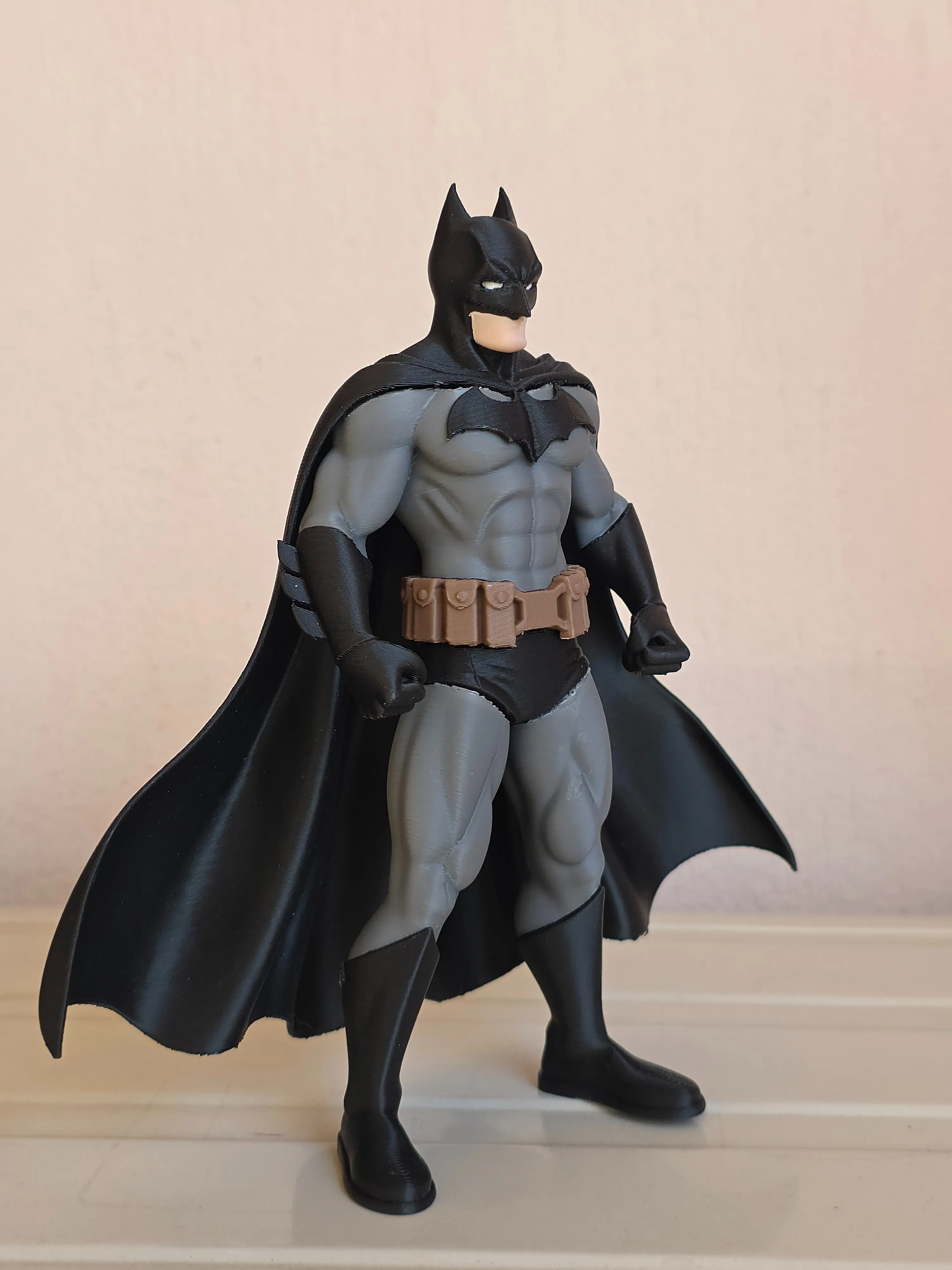 Dark Knight figure printed in grey and black with a brown utility belt