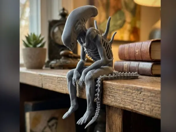 Sad Alien (Xenomorph) Figurine Sitting on a Ledge by ShapeShift 3D Creations