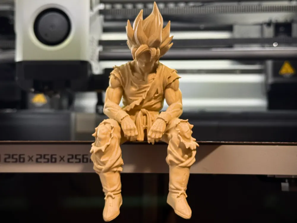 Sad Goku Figurine Sitting on a Ledge by ShapeShift 3D Creations