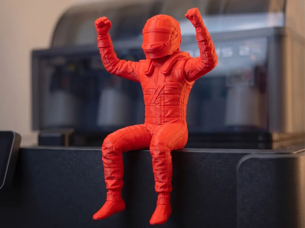 Sitting Champion Racing Driver by Lynns
